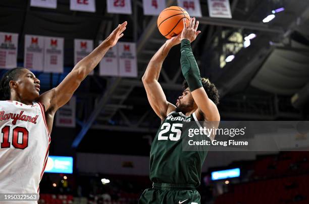 Malik Hall of the Michigan State Spartans shoots the ball in the first half against Julian Reese of the Maryland Terrapins at Xfinity Center on...