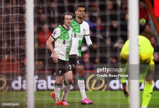 Diogo Jota of Liverpool celebrates scoring his team's second goal with teammate Cody Gakpo during the Premier League match between AFC Bournemouth...