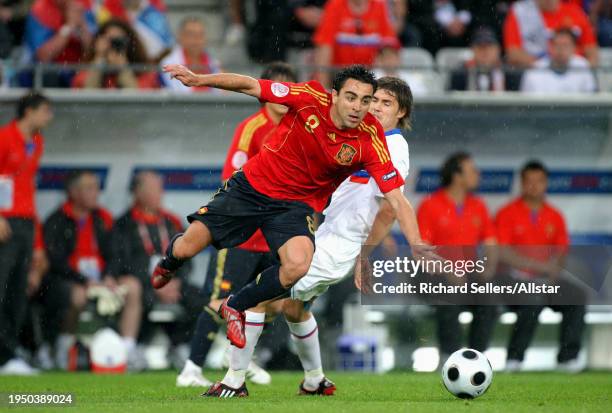 June 10: Xavi of Spain and Dmitri Torbinski of Russia challenge during the UEFA Euro 2008 Group D match between Spain and Russia at Tivoli Nue on...