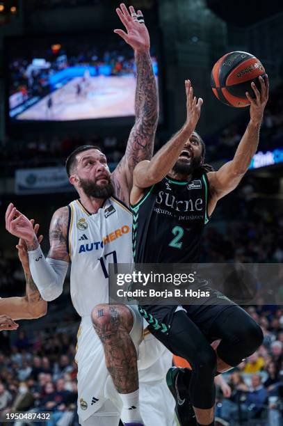 Vincent Poirier of Real Madrid and Adam Smith of Bilbao Basket in action during Liga Endesa match between Real Madrid and Bilbao Basket at WiZink...