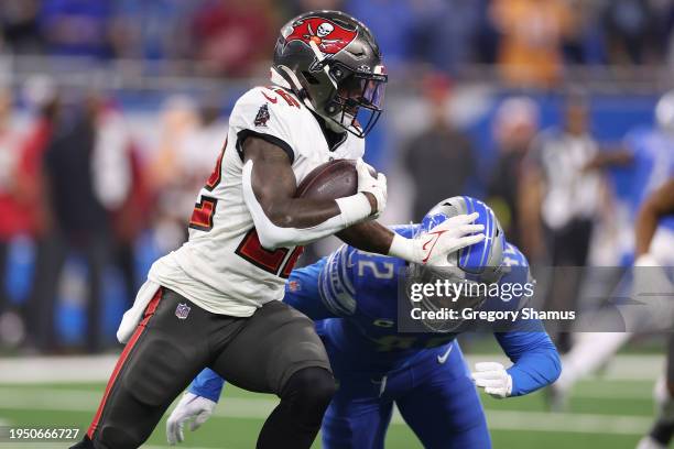 Chase Edmonds of the Tampa Bay Buccaneers is pursued by Jalen Reeves-Maybin of the Detroit Lions during the second quarter of the NFC Divisional...