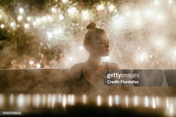 portrait of a teenager girl in the water - girls in hot tub fotografías e imágenes de stock