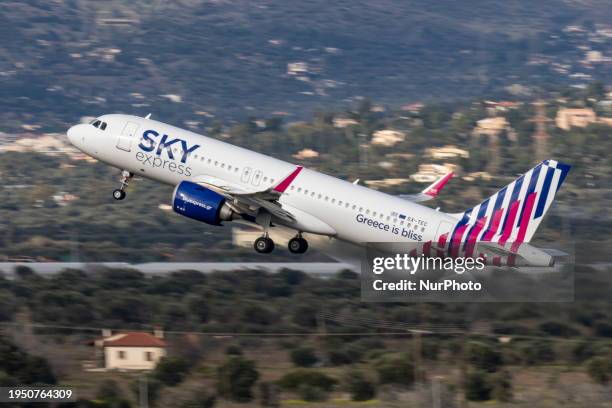 Sky Express Airbus A320neo passenger aircraft as seen taxiing, taking off and flying in the air from Athens International Airport ATH. The modern and...