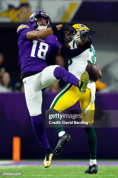 Corey Ballentine of the Green Bay Packers breaks up a pass intended for Justin Jefferson of the Minnesota Vikings in the first half at U.S. Bank...