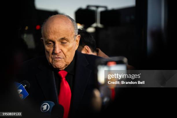 Rudy Giuliani speaks to members of the media where Republican candidate Florida Gov. Ron DeSantis was scheduled to host a campaign event on January...
