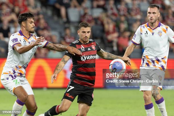 Dylan Pierias of the Wanderers is challenged by the Glory's Riley Warland during the A-League Men round 13 match between Western Sydney Wanderers and...