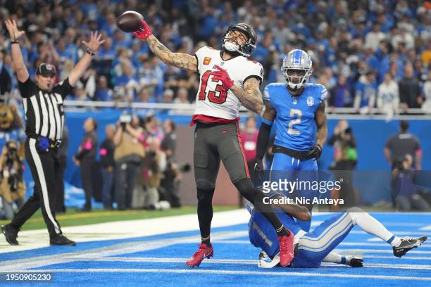 Mike Evans of the Tampa Bay Buccaneers celebrates a touchdown against the Detroit Lions during the fourth quarter of the NFC Divisional Playoff game...