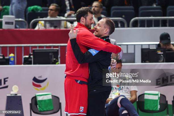 Domagoj Duvnjak of Croatia hugs German Coach Mattias Andersson prior to the Men's EHF Euro 2024 main round match between Germany and Croatia at...