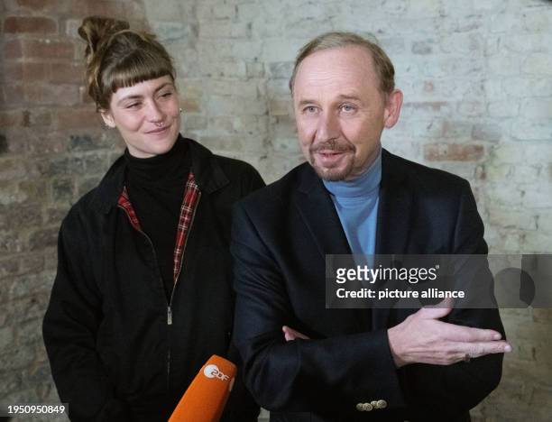 January 2024, Mecklenburg-Western Pomerania, Stralsund: Actors Sophie Pfennigstorf and Alexander Held signing the guest book of the town of...