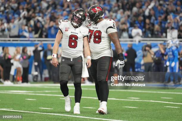 Baker Mayfield of the Tampa Bay Buccaneers speaks with Tristan Wirfs after throwing an interception against the Detroit Lions during the fourth...