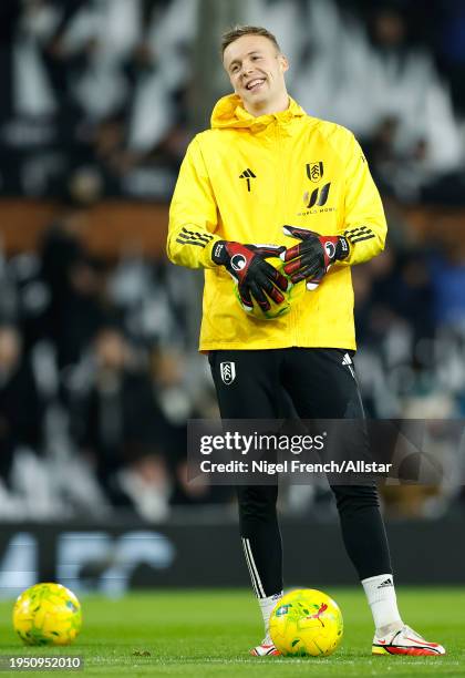 Marek Rodak, goalkeeper of Fulham warms up before the Carabao Cup Semi Final Second Leg match between Fulham and Liverpool at Craven Cottage on...