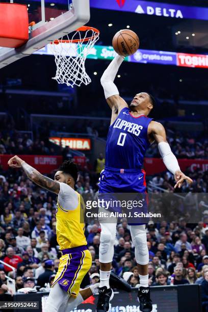Clippers guard Russell Westbrook dunks the ball against Los Angeles Lakers guard D'Angelo Russell during the first half at Crypto.com Arena on...