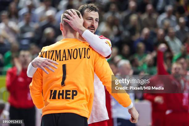 Domagoj Duvnjak and goalkeeper of Croatia Dominik Kuzmanovic celebrates a save during the Men's EHF Euro 2024 main round match between Germany and...