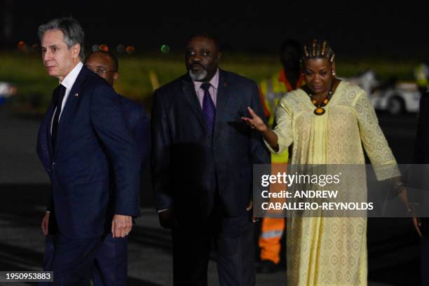 Secretary of State Antony Blinken is welcomed by Paula Castro , director of the General Directorate of State Protocol of MIREX, and Felisberto...