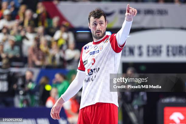 Domagoj Duvnjak of Croatia points during the Men's EHF Euro 2024 main round match between Germany and Croatia at Lanxess Arena on January 24, 2024 in...