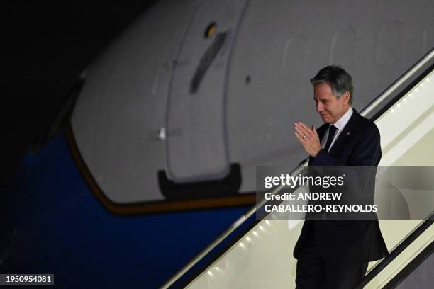 Secretary of State Antony Blinken waves as he arrives at the Quatro de Fevereiro International Airport in Angola on January 24, 2024.