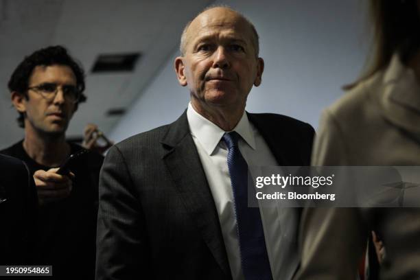 Dave Calhoun, chief executive officer of Boeing Co., center, departs after a meeting at the office of Senator Maria Cantwell, a Democrat from...