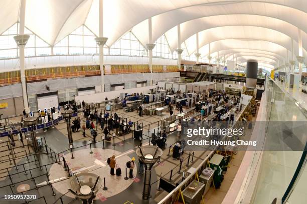 Travelers line at security check point at Denver International Airport in Denver, Colorado on Wednesday, January 24, 2024.