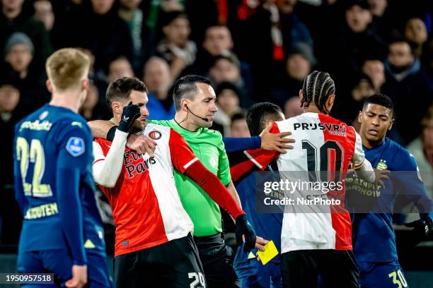 Feyenoord player Santiago Giminez is interacting with referee Dennis Higler during the match between Feyenoord and PSV for the KNVB Beker season...