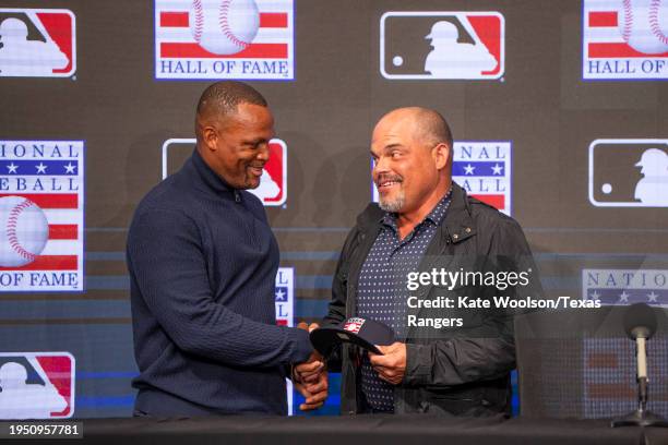 Former Texas Ranger Adrián Beltré shakes Hall of Famer Iván Rodríguez' hand during the Media Availability following his induction into the National...