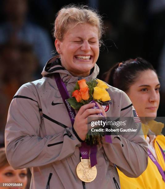 Judo wrestler Kayla Harrison holds back tears as the National Anthem plays during her Gold Medal ceremony at the London 2012 Olympics.