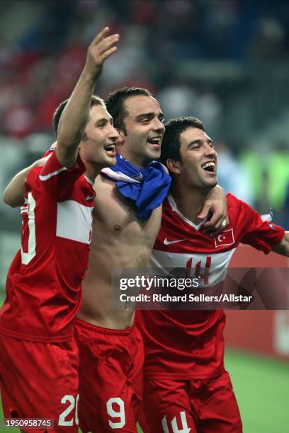 June 20: Sabri Sarioglu, Semih Senturk and Arda Turan of Turkey celebrate after winning the UEFA Euro 2008 Quarter Final match between Croatia and...