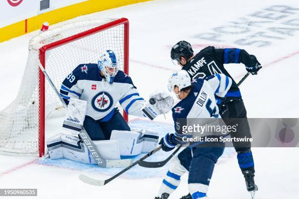 Winnipeg Jets Goalie Laurent Brossoit makes a save during the first period of the NHL regular season game between the Winnipeg Jets and the Toronto...