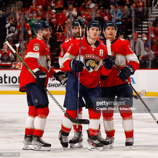 Matthew Tkachuk of the Florida Panthers celebrates his goal with teammates during the first period against the Arizona Coyotes at the Amerant Bank...