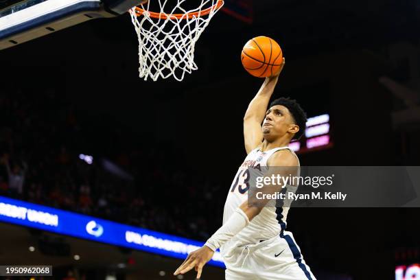 Ryan Dunn of the Virginia Cavaliers dunks in overtime during a game against the NC State Wolfpack at John Paul Jones Arena on January 24, 2024 in...