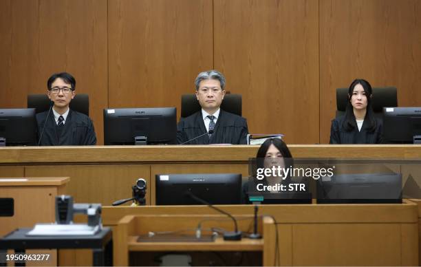 Presiding Judge Keisuke Masuda of Kyoto District Court and others attend a courtroom where defendant Shinji Aoba's sentencing hearing in Kyoto on...