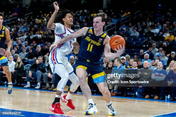 Marquette Golden Eagles guard Tyler Kolek attempts to drive to the basket while being guarded by DePaul Blue Demons guard Jalen Terry during the...