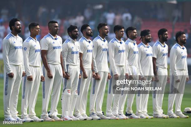 India's players stand for their national anthem before the start of the first day of the first Test cricket match between India and England at the...