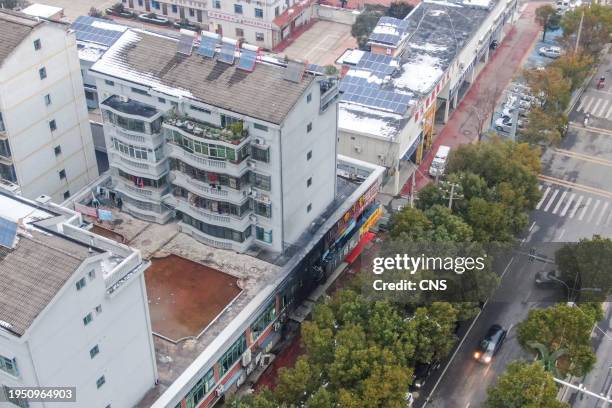 Burn marks are seen on a store front the morning after a fire which left at least 39 people dead in Xinyu, in China's central Jiangxi province, on...