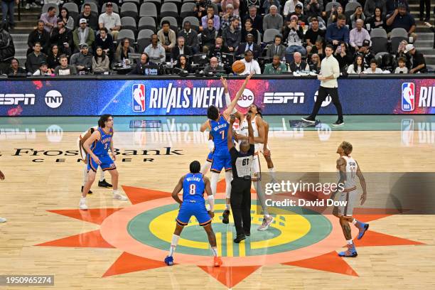 Chet Holmgren of the Oklahoma City Thunder and Victor Wembanyama of the San Antonio Spurs go for the opening tip-off on January 24, 2023 at the Frost...