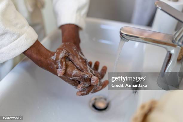 person practicing handwashing in sink - soap hands foam stock pictures, royalty-free photos & images