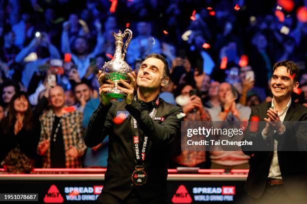 Ronnie O'Sullivan of England poses with the trophy after winning the Final match against Judd Trump of England on day 7 of the 2024 Spreadex World...