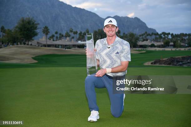 Nick Dunlap of the United States poses for a photo with the trophy after winning The American Express at Pete Dye Stadium Course on January 21, 2024...