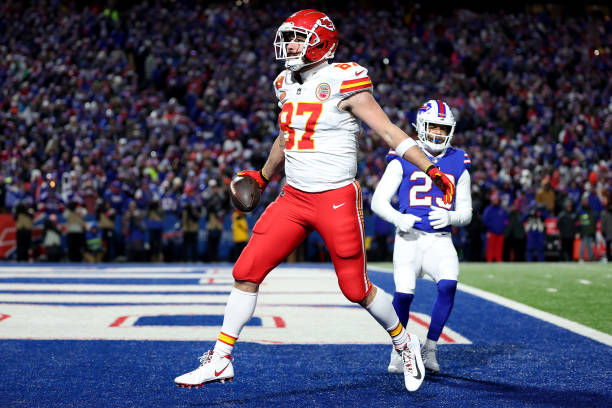 Travis Kelce of the Kansas City Chiefs celebrates after scoring a 22 yard touchdown against the Buffalo Bills during the second quarter in the AFC...