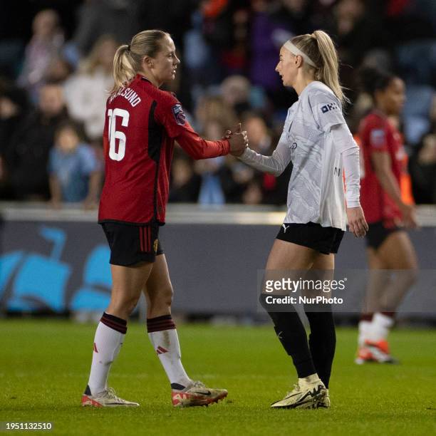 Chloe Kelly of Manchester City and Lisa Naalsund of Manchester United WFC are shaking hands at full time during the FA Women's League Cup Group B...