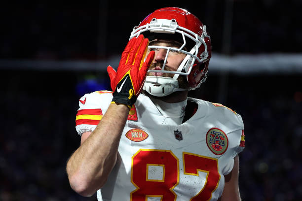 Travis Kelce of the Kansas City Chiefs celebrates after scoring a 22 yard touchdown against the Buffalo Bills during the second quarter in the AFC...