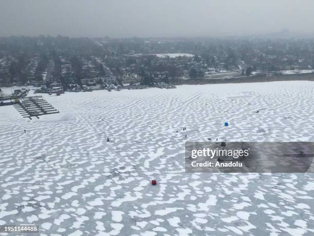 An aerial view of people ice fishing at Frenchman's Bay on Lake Ontario in Pickering, Ontario, Canada on January 23, 2024.