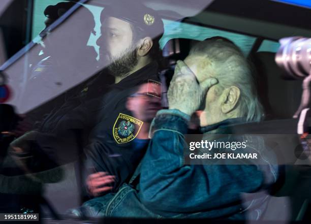 Austrian Josef Fritzl, who imprisoned his daughter in a cellar for over 24 years and fathered seven children with her, is escorted back to a prison...