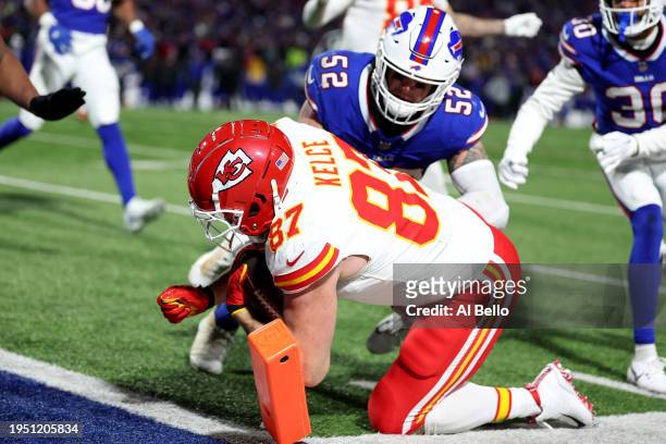 Travis Kelce of the Kansas City Chiefs scores a three yard touchdown against A.J. Klein of the Buffalo Bills during the third quarter in the AFC...