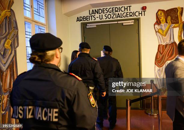 Judicial officers enter the courtroom during a hearing of Austrian Josef Fritzl, who imprisoned his daughter in a cellar for over 24 years and...