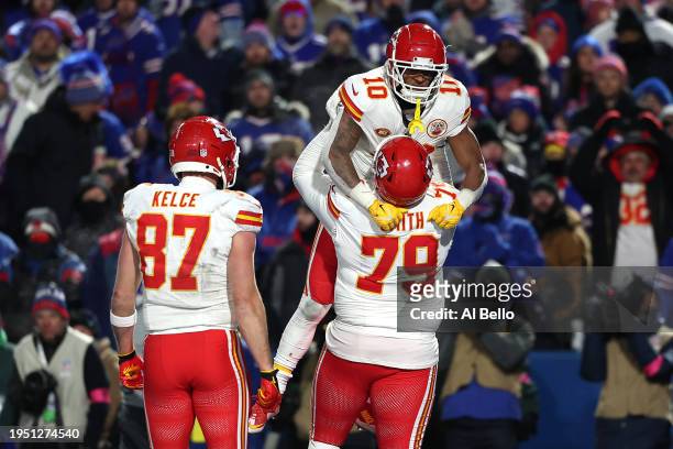 Isiah Pacheco of the Kansas City Chiefs celebrates with Donovan Smith after scoring a touchdown against the Buffalo Bills during the fourth quarter...