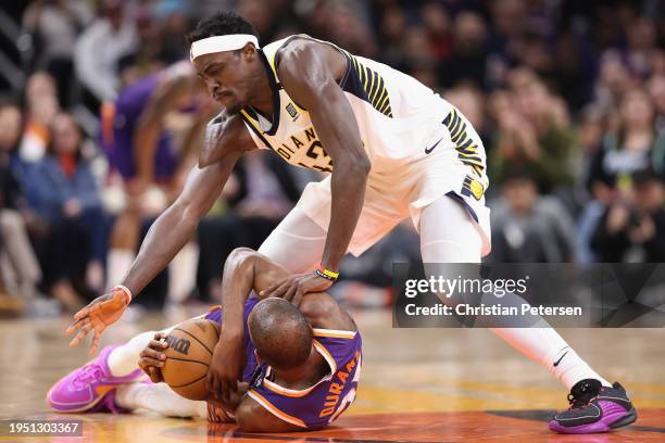 Pascal Siakam of the Indiana Pacers attempts to steal the ball from Kevin Durant of the Phoenix Suns during the first half of the NBA game at...