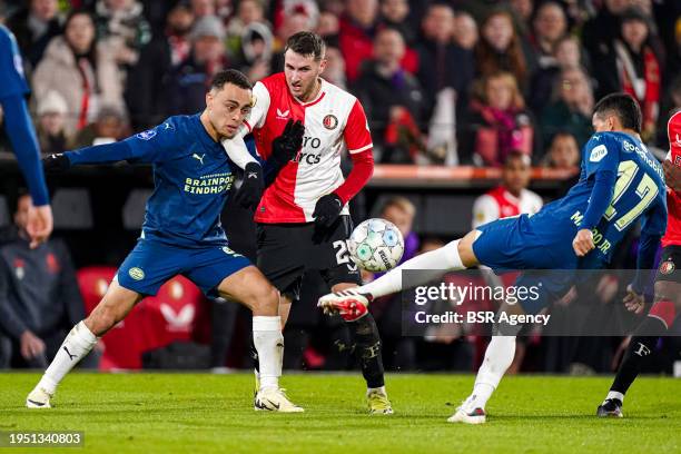 Sergino Dest of PSV battles for possession with Santiago Gimenez of Feyenoord and Mauro Junior of PSV during the TOTO KNVB Cup match between...