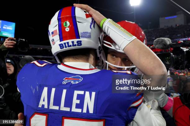 Patrick Mahomes of the Kansas City Chiefs hugs Josh Allen of the Buffalo Bills after the AFC Divisional Playoff game at Highmark Stadium on January...