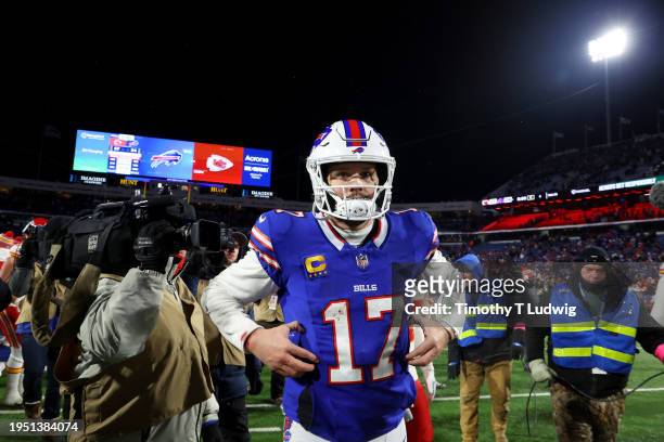 Josh Allen of the Buffalo Bills runs off the field after being defeated by the Kansas City Chiefs in the AFC Divisional Playoff game at Highmark...
