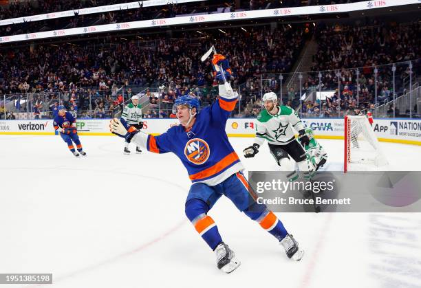 Bo Horvat of the New York Islanders scores the game-winning goal at 41 seconds of overtime against the Dallas Stars at UBS Arena on January 21, 2024...